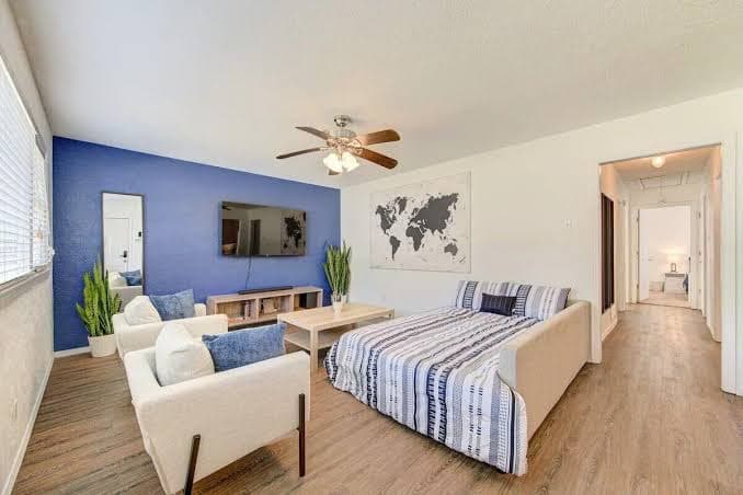 King bed with Pool table, decked patio and, gym.